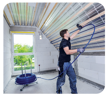 Heating engineer fixing ceiling heating panels securely to timber battens